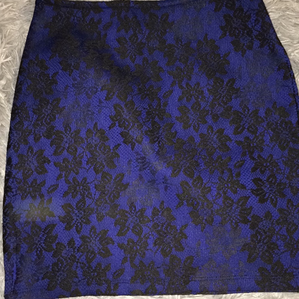 Dark blue tight skirt with black floral lace.